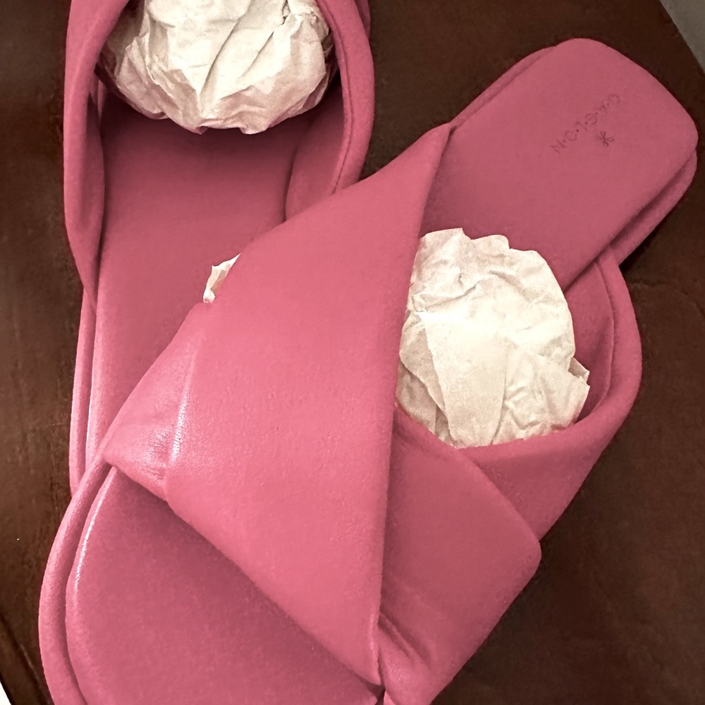 Pink leather padded slides.